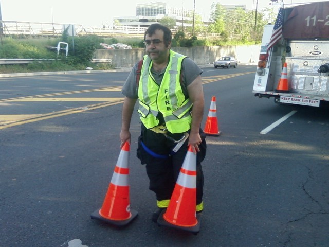 Ex-Chief Freeman putting out cones at a reported car fire